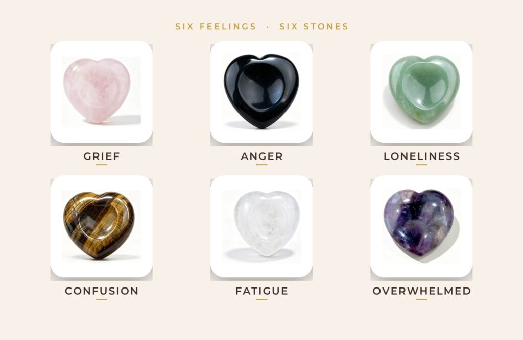 Six RisUni heart-shaped thumb stones in a grid, each labelled with a feeling: rose quartz, black obsidian, green aventurine, tiger eye, clear quartz and amethyst.